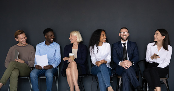 diverse multigenerational employees talking to each other